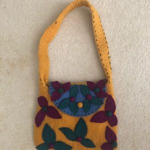 Felted girl purse with small dot spit on handle